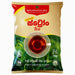A 1kg package of Bogawantalawa Extra Ceylon Tea, featuring a beige and green design with a clear window showing the dark red tea inside.