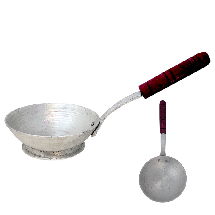 Metal ladle with a red handle on a white background