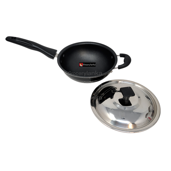 Black frying pan with a silver lid on a white background